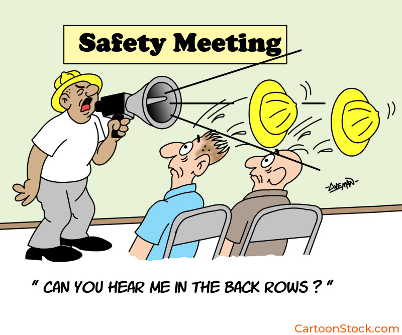 cartoon about
a safety meeting in a large room